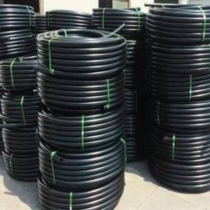 Coiled HDPE pipes neatly stacked, showcasing versatility and quality